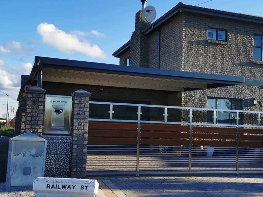 Completed carport installation with vehicles parked underneath