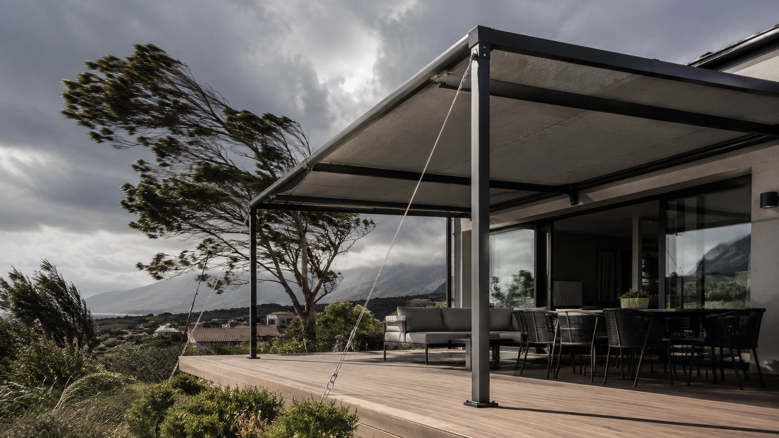 Freestanding aluminium awning structure on an exposed open site under a windy sky