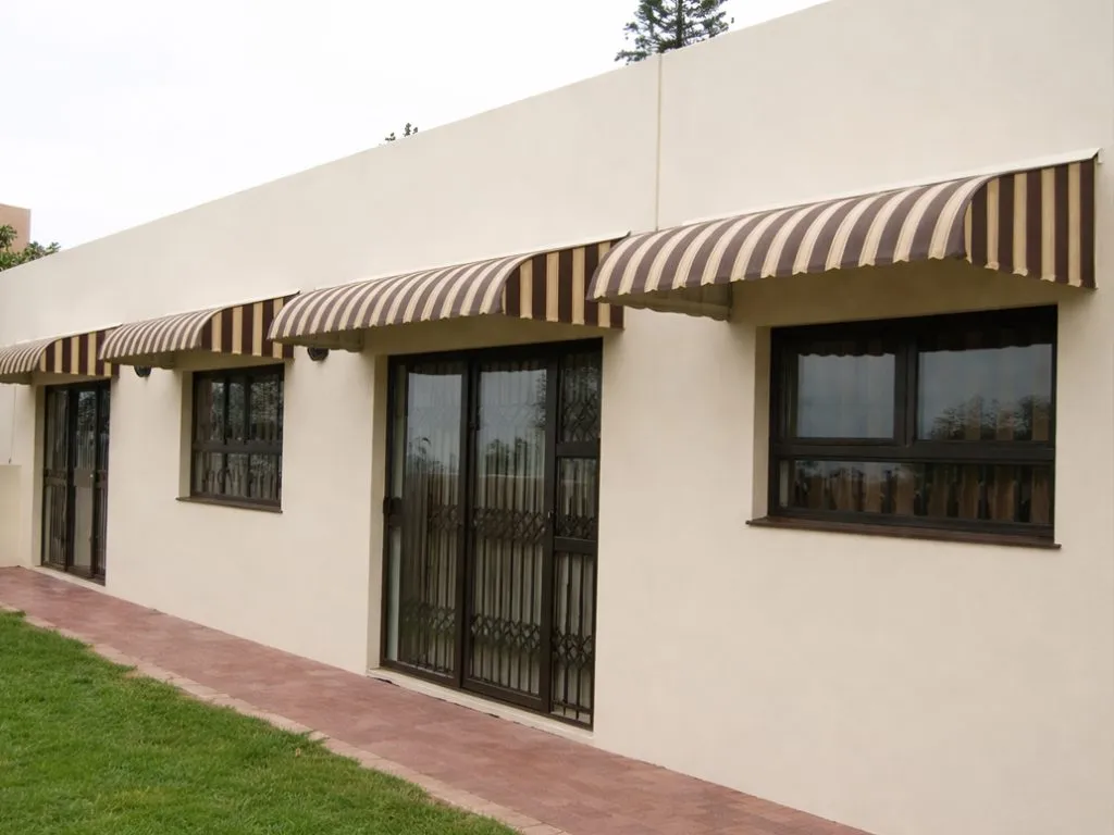 Coordinated aluminium awnings installed over windows and doors